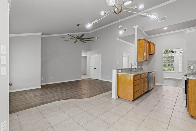 kitchen with visible vents, stainless steel dishwasher, a sink, ceiling fan with notable chandelier, and ornamental molding