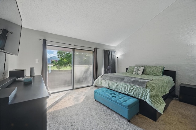 bedroom with lofted ceiling, carpet, access to outside, and a textured ceiling