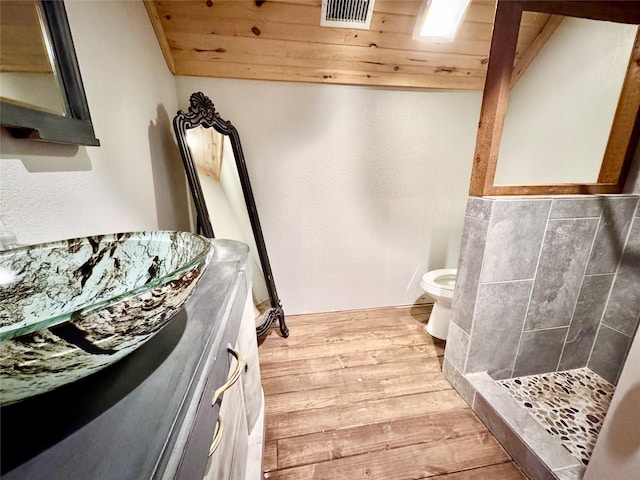 11300 Massey Rd, Pilot Point, TX 76258 - full bathroom featuring wood finished floors, a shower stall, toilet, wooden ceiling, and vanity