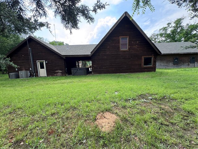 11300 Massey Rd, Pilot Point, TX 76258 - rear view of property featuring a lawn and central air condition unit