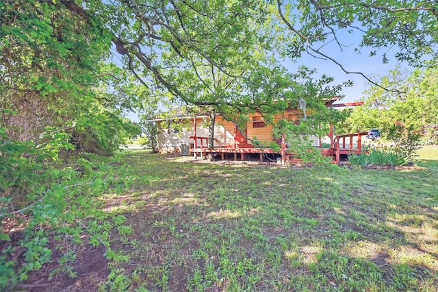 view of yard with a wooden deck