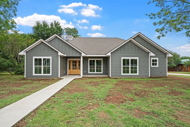 single story home with board and batten siding and roof with shingles
