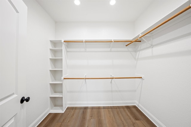 spacious closet with wood finished floors