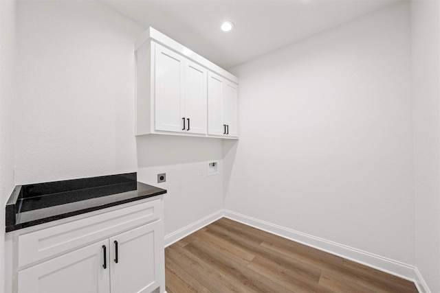 laundry area with recessed lighting, light wood-type flooring, electric dryer hookup, hookup for a washing machine, and baseboards