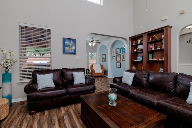 4953 Van Zandt Dr, Fort Worth, TX 76244 - living area featuring dark wood finished floors, baseboards, arched walkways, and a high ceiling