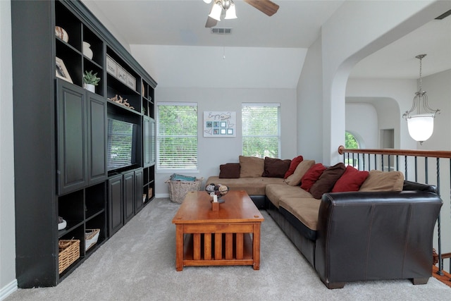 4953 Van Zandt Dr, Fort Worth, TX 76244 - living area featuring arched walkways, light colored carpet, ceiling fan, baseboards, and visible vents