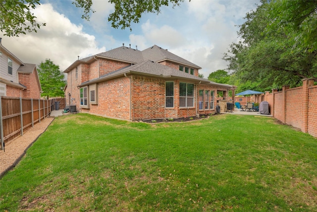 4953 Van Zandt Dr, Fort Worth, TX 76244 - back of house featuring a patio, central AC, a fenced backyard, and brick siding
