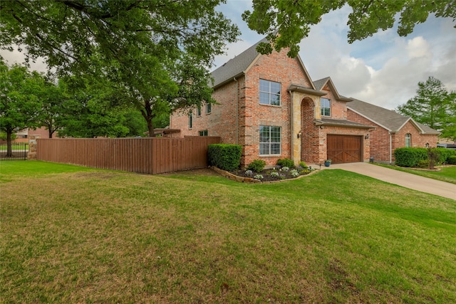 4953 Van Zandt Dr, Fort Worth, TX 76244 - view of side of home with brick siding, fence, driveway, and a lawn