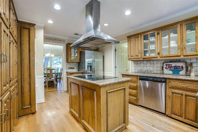 7215 Hillwood Ln, Dallas, TX 75248 - kitchen featuring appliances with stainless steel finishes, island exhaust hood, ornamental molding, brown cabinetry, and recessed lighting