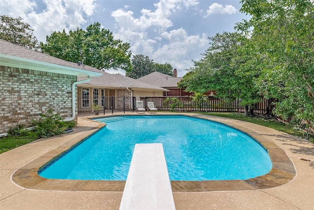 7215 Hillwood Ln, Dallas, TX 75248 - view of swimming pool with a diving board and fence