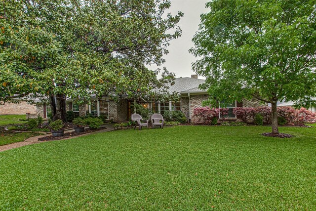 7215 Hillwood Ln, Dallas, TX 75248 - back of house featuring a lawn, a chimney, and brick siding
