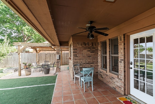 view of patio / terrace featuring a fenced backyard, outdoor dining area, a pergola, and ceiling fan