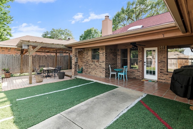 view of patio / terrace featuring fence, ceiling fan, and area for grilling