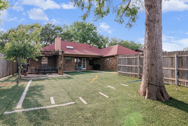 view of yard with a fenced backyard, a pergola, and a patio