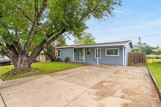 4512 Wabash Ave, Fort Worth, TX 76133 - ranch-style home with fence, concrete driveway, a porch, and a front lawn