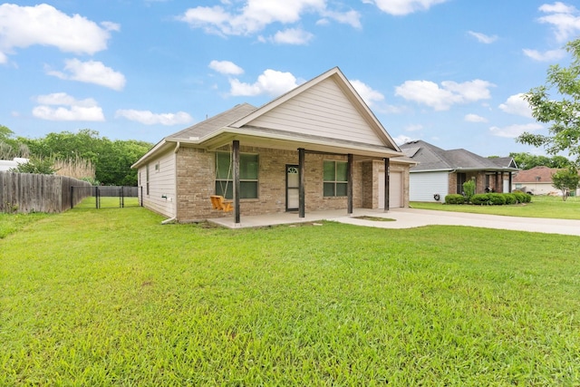 305 S 1st St, Grandview, TX 76050 - view of front of home with a porch, driveway, brick siding, fence, and a front lawn