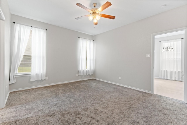 305 S 1st St, Grandview, TX 76050 - carpeted spare room with baseboards, ceiling fan with notable chandelier, and a wealth of natural light