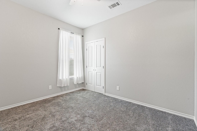 305 S 1st St, Grandview, TX 76050 - empty room with a ceiling fan, baseboards, visible vents, and carpet