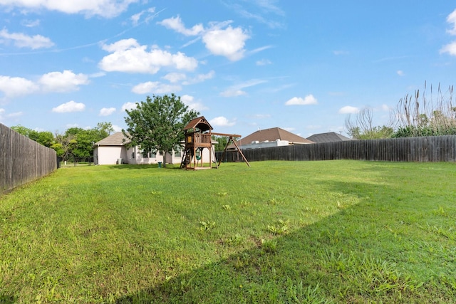 305 S 1st St, Grandview, TX 76050 - view of yard featuring a fenced backyard and a playground