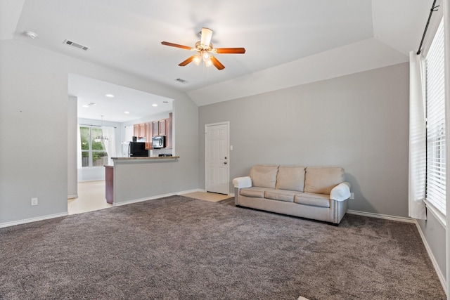 305 S 1st St, Grandview, TX 76050 - living area featuring light colored carpet, a ceiling fan, and visible vents