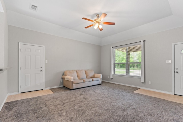 305 S 1st St, Grandview, TX 76050 - carpeted living area featuring ceiling fan, visible vents, and baseboards