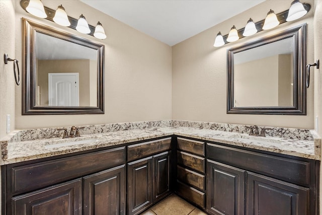 4339 Paige Dr, Caddo Mills, TX 75135 - bathroom featuring double vanity, a sink, and tile patterned floors