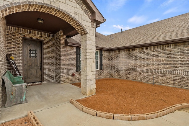 4339 Paige Dr, Caddo Mills, TX 75135 - property entrance featuring a shingled roof and brick siding