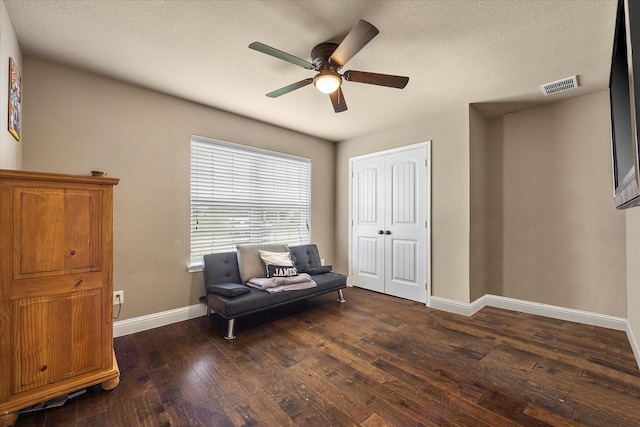4339 Paige Dr, Caddo Mills, TX 75135 - living area featuring wood-type flooring, a ceiling fan, visible vents, baseboards, and a textured ceiling