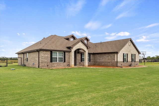 4339 Paige Dr, Caddo Mills, TX 75135 - ranch-style house with a front yard, a shingled roof, brick siding, and stone siding