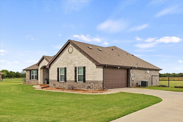 4339 Paige Dr, Caddo Mills, TX 75135 - view of property exterior featuring a lawn, concrete driveway, brick siding, and a garage
