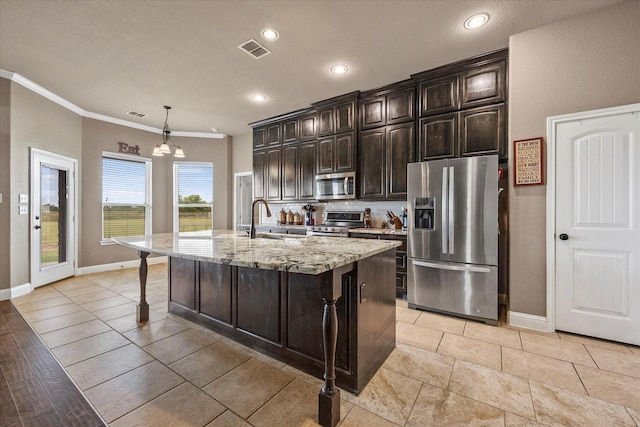 4339 Paige Dr, Caddo Mills, TX 75135 - kitchen with crown molding, visible vents, stainless steel appliances, and baseboards