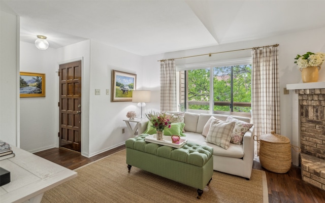 living area featuring wood finished floors and baseboards