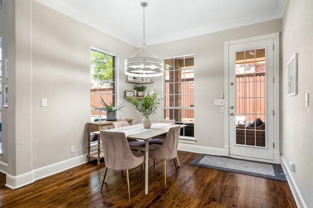 dining area with a chandelier, baseboards, ornamental molding, and dark wood-style floors