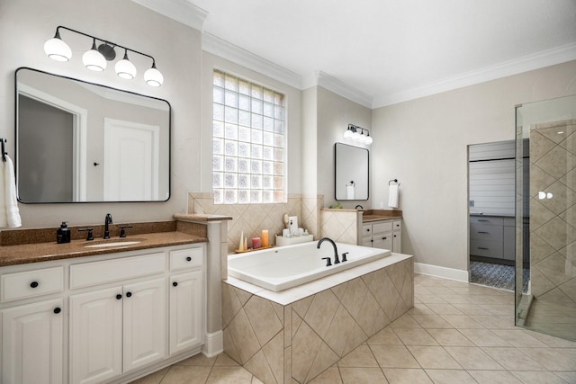 full bath with a sink, crown molding, a tile shower, a garden tub, and tile patterned flooring