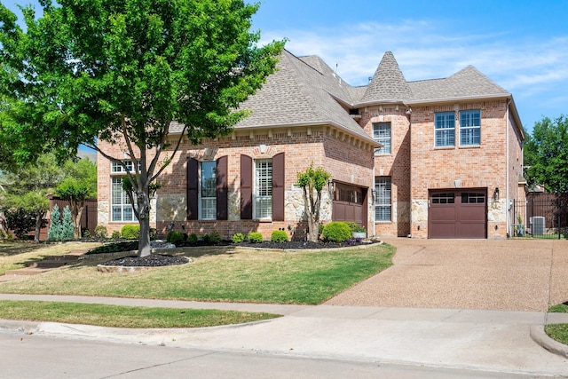 french country inspired facade with a front lawn, a garage, a shingled roof, brick siding, and concrete driveway