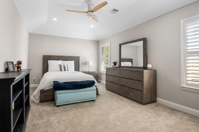 bedroom with light colored carpet, visible vents, recessed lighting, and baseboards