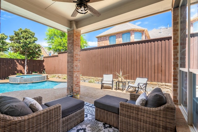 view of patio / terrace with ceiling fan, a fenced backyard, and a pool with connected hot tub