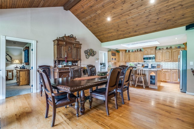 dining room featuring recessed lighting, wooden ceiling, light wood finished floors, beam ceiling, and high vaulted ceiling
