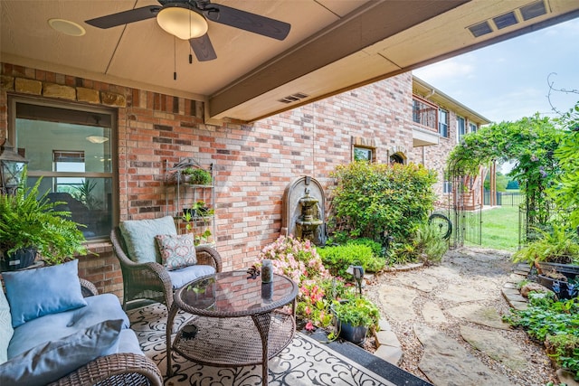 view of patio / terrace featuring ceiling fan and visible vents