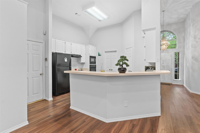 kitchen with black appliances, dark wood-style flooring, light countertops, and white cabinets