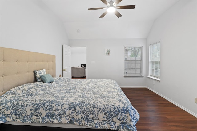 bedroom featuring lofted ceiling, wood finished floors, ceiling fan, and baseboards