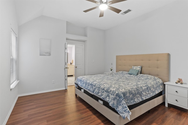 bedroom with lofted ceiling, visible vents, baseboards, dark wood finished floors, and a ceiling fan
