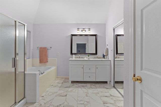 bathroom featuring vanity, a shower stall, a bath, and marble finish floor