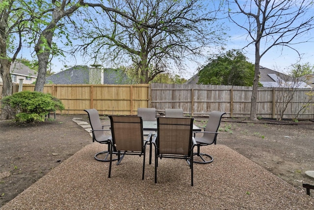 view of patio / terrace with outdoor dining space and a fenced backyard