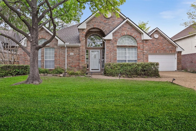 view of front of house featuring a front lawn, brick siding, driveway, roof with shingles, and an attached garage