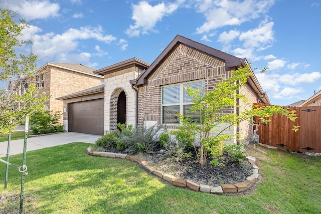 view of front of house with fence, an attached garage, brick siding, a front yard, and driveway