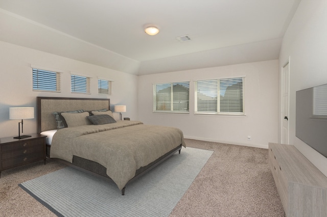 carpeted bedroom with multiple windows and visible vents
