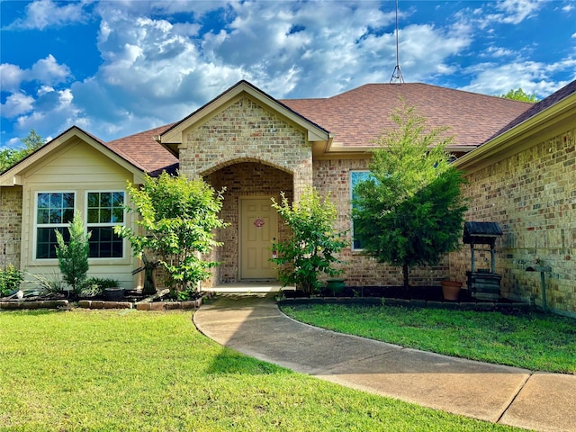 207 Shary St, Aledo, TX 76008 - view of front of home featuring a front lawn, a shingled roof, and brick siding