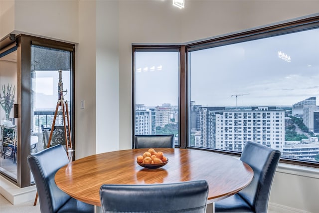 3030 Mckinney Ave Unit 1804, Dallas, TX 75204 - dining room with a city view and baseboards