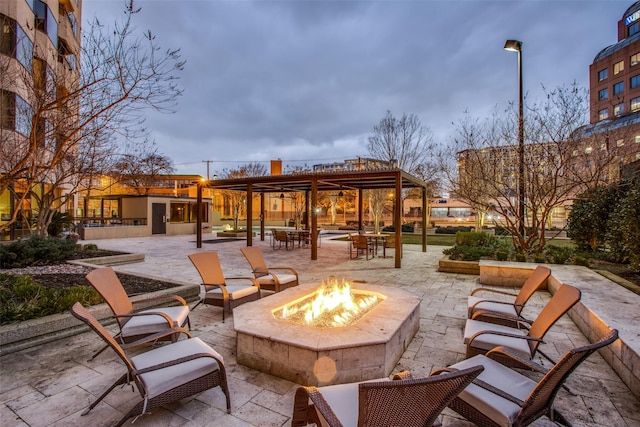 3030 Mckinney Ave Unit 1804, Dallas, TX 75204 - view of patio / terrace featuring an outdoor fire pit and a pergola